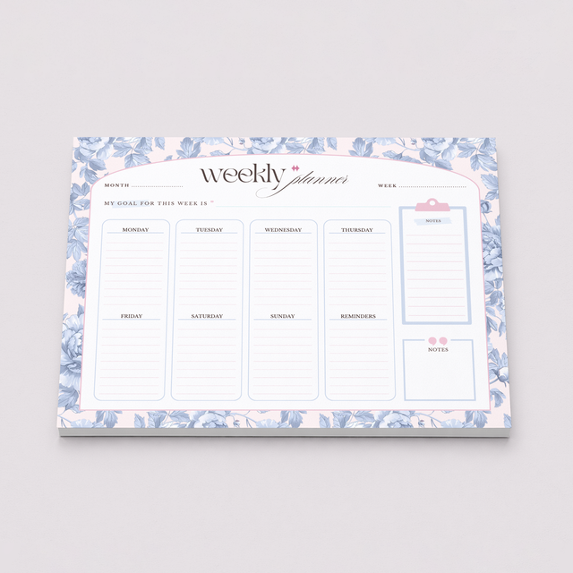 Weekly planner with floral design on a gray background