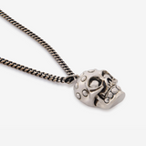 The Knuckle Skull Necklace in Antique Silver