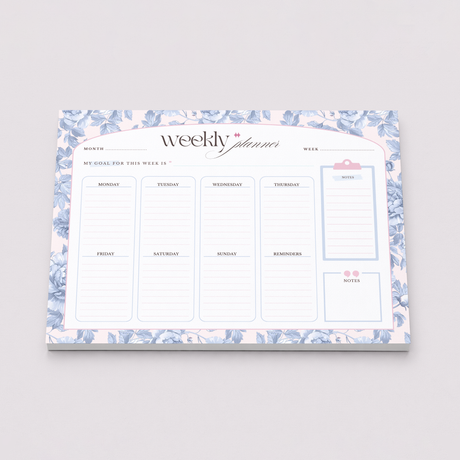 Weekly planner with floral design on a gray background